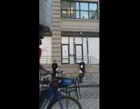 Man Balances Trash Bin on its Head