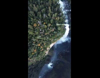 Collab PubityPets - Aerial view of the waterfalls beside the trees by the forest