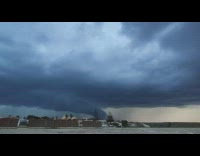 Large thick clouds flickers and produces lightning