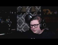 Guy bends over wearing pink thong