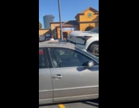 Car crashes on top of another car