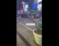 Man Drags a Coffin Down on Time Square