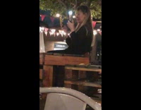 Woman hold two phones for picture and flashlight