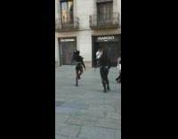 Dog holds water bottle four girls dance video shoot