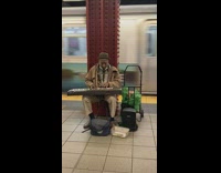 Man brown jacket sing play keyboard subway station