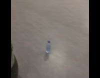 Guy flips water bottle hits wall stairs 