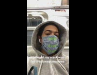 Brown bird costume mask guy subway train 