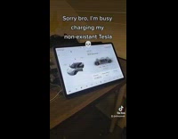 Tesla charging app on ipad next to desk 