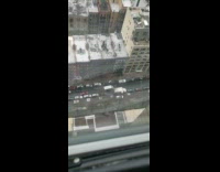 Car drives on sidewalk to avoid traffic 