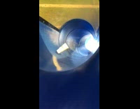 Paper cup floats in the slide because of the wind