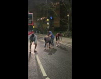 Bus honks at guys playing leap frog 