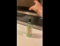 Guy drop cap land upside down on bottle