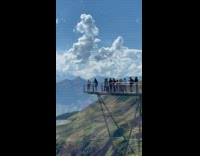 Collab IITW - Woman whips hair on the cliff walk