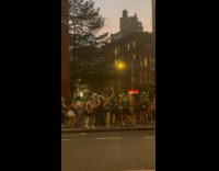 Crowd dance at silent party on street