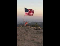 Girl red bikini american flag pole mountain Independence Day