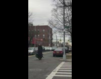 Guy rides scooter with cargo 