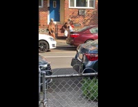 Green purse girl poses sidewalk red shirt 