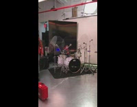 Little girl plays drums guy plays piano