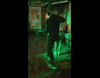 Guy dancing to pop lock and drop it at club