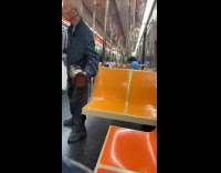 Submitter films old man circling inside train