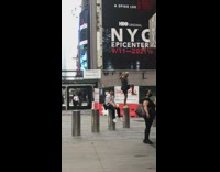 Man stands on pillar on one leg