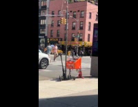 Guy shouts wildly beside LinkNYC kiosk