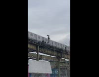 Guy sits on roof of moving train 
