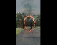 Guy roller blades jump in ring of fire