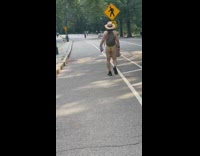 Man has bare butt out on walk in park