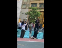 Woman wears suit dance for video shoot