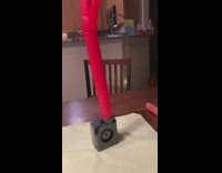 Slow motion video of red floppy balloon moving 