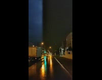 Person walk street night captured two lightning