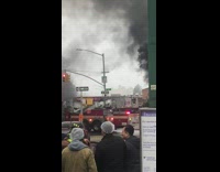 Firefighters respond to fire in front of bus stop