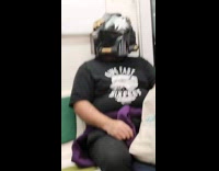 Man in Space Marine Helmet Sits Still