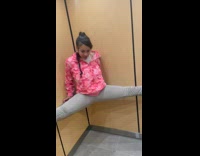 Girl does push ups in elevator splits 