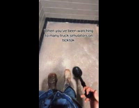 Man plays truck simulator inside the bathroom