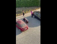 Girl black pants one leg tiptoe car