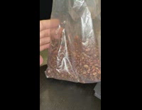 Guy moves hand by brown cereal bag 