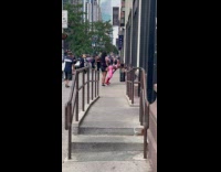 Collab winy - Woman dances and  twerks on the sidewalk 