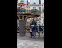 Collab IITW - Woman crop top vest dances beside park carousel