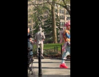 Bunny man wears roller skates at park
