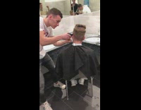 Boys with a haircut session inside the bathroom