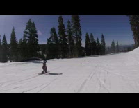 Snowboarder tries to grind yellow caution ramp and flips over ramp