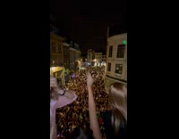 Indoor party at a neighborhood block party full of people