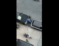 Lady shaves guys head by parked car