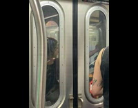 Woman smoke cigarettes outside between subway cars
