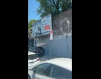 Monster decoration with long limbs on street