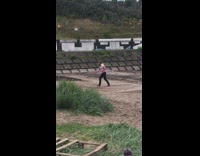 Tie dye sweater guy jump spin kick 