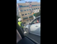 Woman driver argue with traffic enforcer stoplight