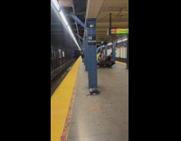 Guy takes video of sandwich maker use in subway 